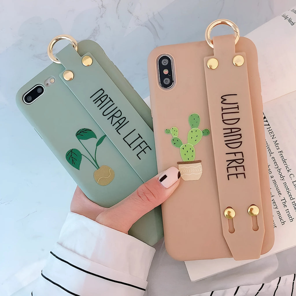 Green graffiti-style phone case with a wristband holder for an iPhone.