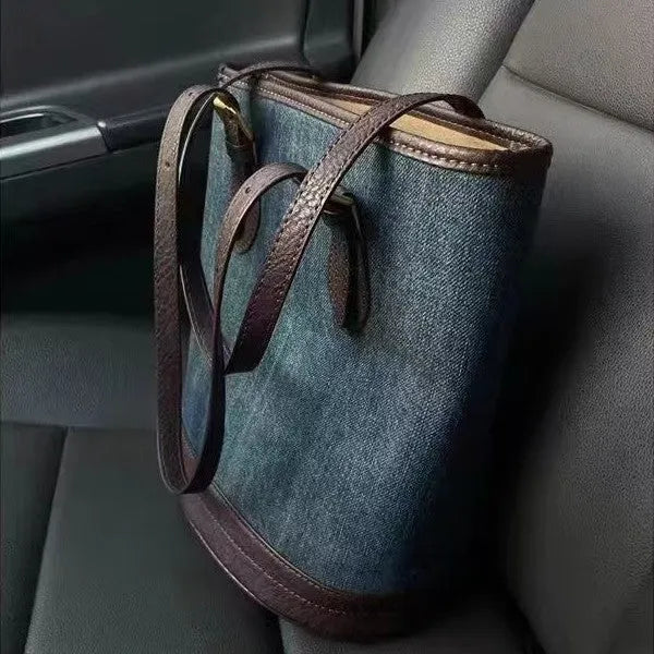 Denim patchwork one-shoulder bucket handbag showing 23x27x16cm dimensions and polyester construction