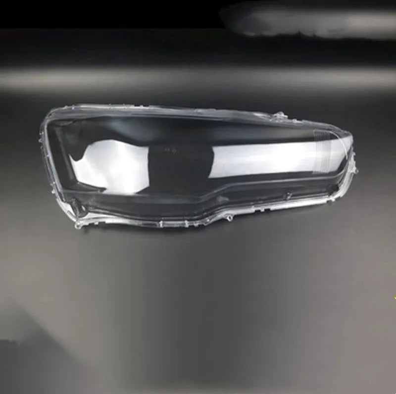 Transparent plastic headlight housing covers for driver and passenger positions