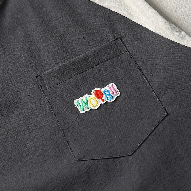 Dark grey men's loose fit t-shirt with contrasting colour raglan short sleeves.