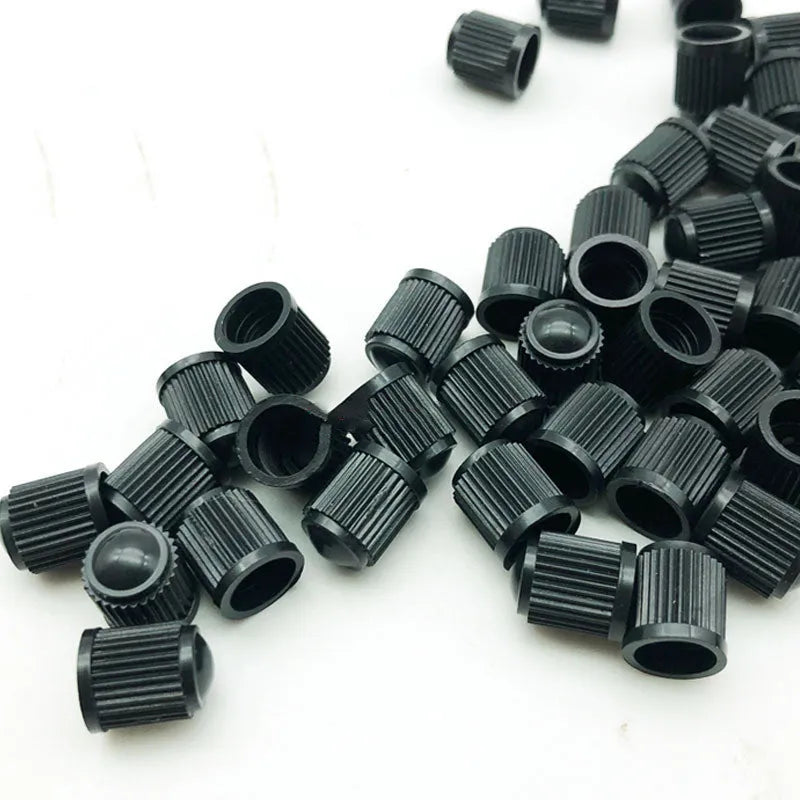 Black plastic tubeless valve with American mouth thread for GM models on white background