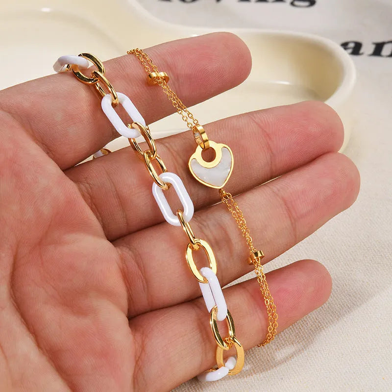 Stainless steel resin bracelet with a double-layer loving heart charm for women.