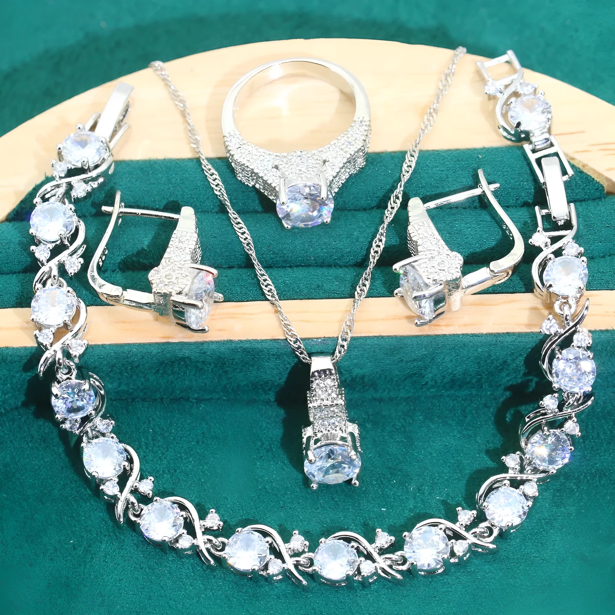 Bridal zircon necklace, bracelet, earrings, and ring four-piece jewellery set in alloy with water wave chain design.