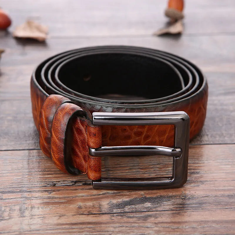 Men's black business belt with alloy pin buckle showing a laser-etched elephant pattern design.