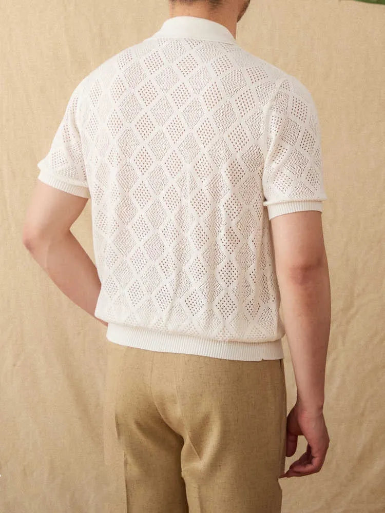 White cotton cardigan with zipper front and lapel collar showing short sleeve design