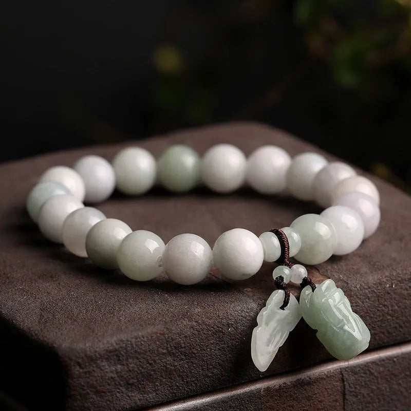 Natural emerald jade bracelet with geometric pendant and Maitreya Buddha charm