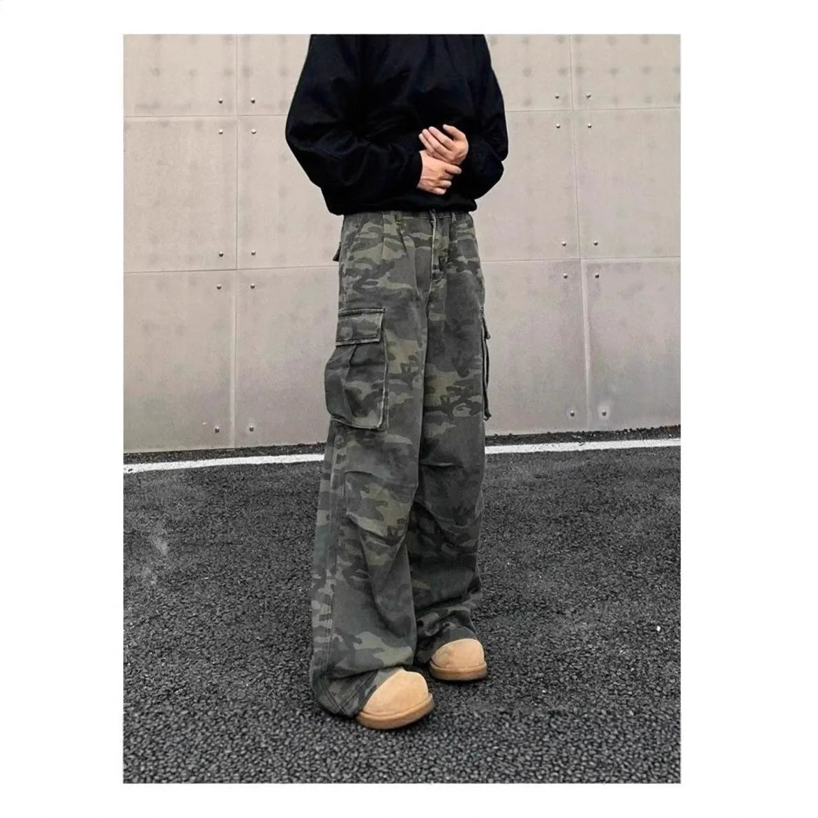 Cotton blend cargo pants in a washed camouflage print with multiple pockets and a mid waist.