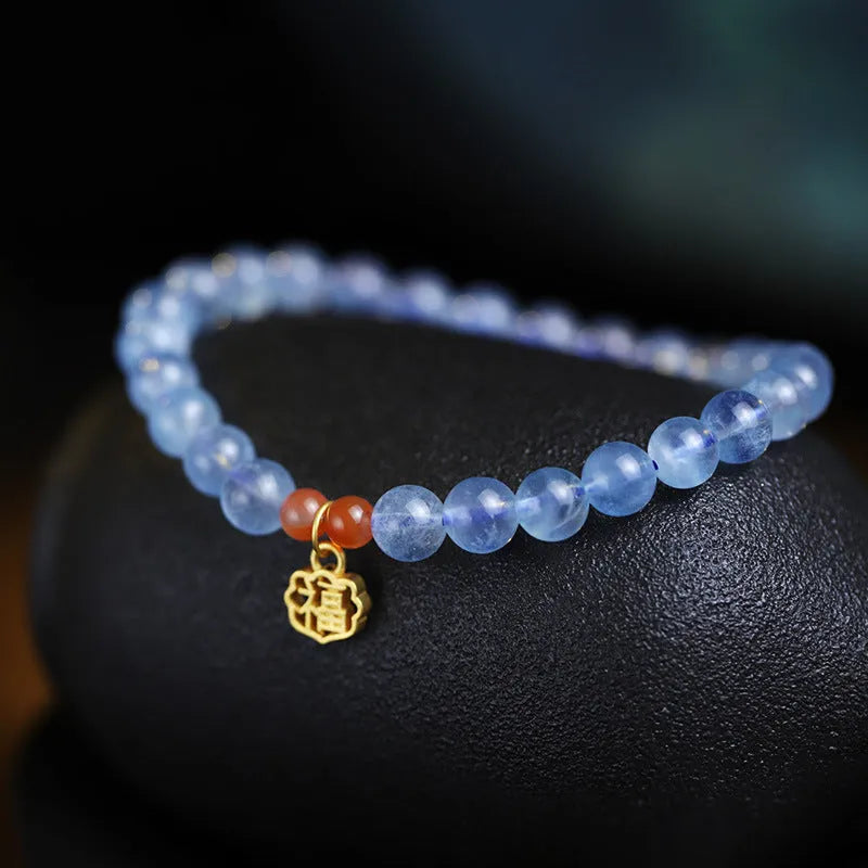 Ice translucent aquamarine bracelet with 8mm round beads and silver sequin accents
