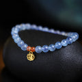 Ice translucent aquamarine bracelet with 8mm round beads and silver sequin accents
