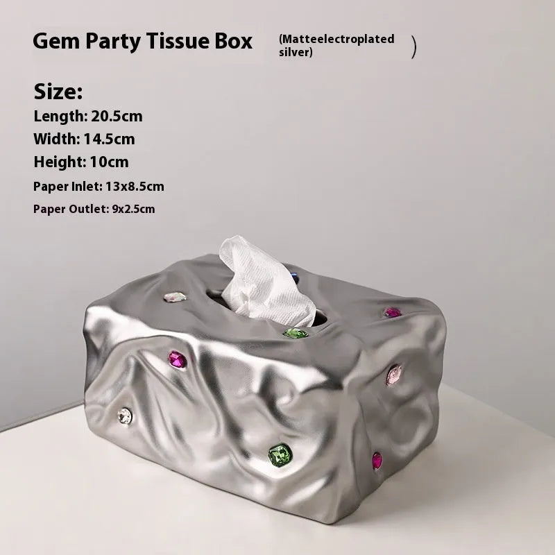 Ceramic tissue box in matte white or silver luxury finish for home decor.