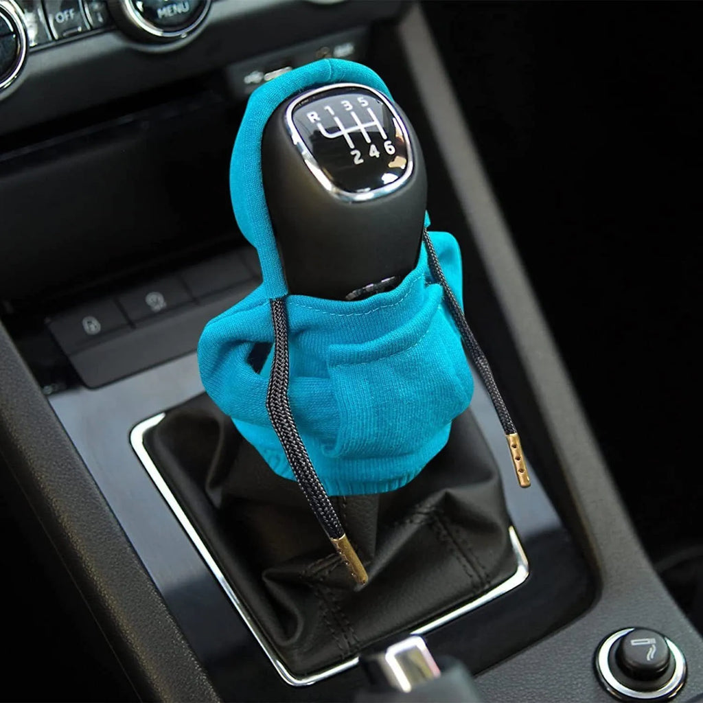 Cloth car gear shift knob cover in various colours showing its 13cm by 8cm size
