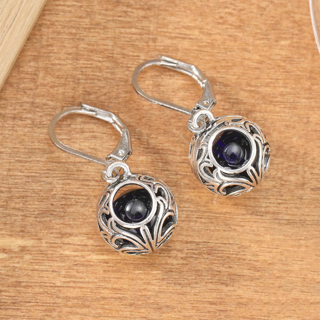 Women's silver geometric hollow pendant earrings with vintage engraving and blue gemstone accents