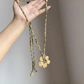 Gold hibiscus rosa-sinensis resin pendant necklace with artificial crystal bow on alloy chain for ladies
