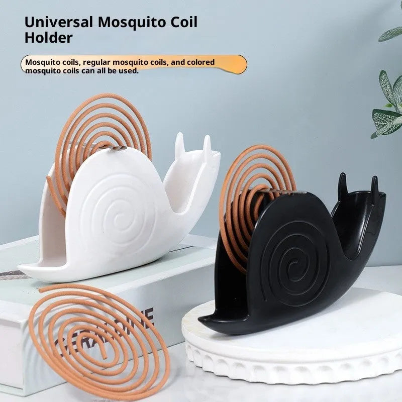 Black plastic mosquito incense holder with creative animal style on a flat surface