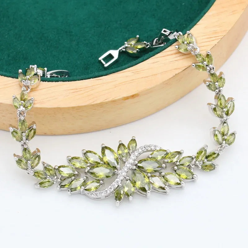 Retro floral pattern jewellery set with copper, zircon, and alloy pendant, showing necklace, bracelet, earrings, and ring in olive and purple colours.