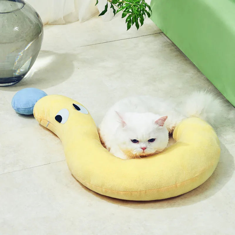Blue pet sleeping pillow measuring 62cm by 39cm on a dog bed
