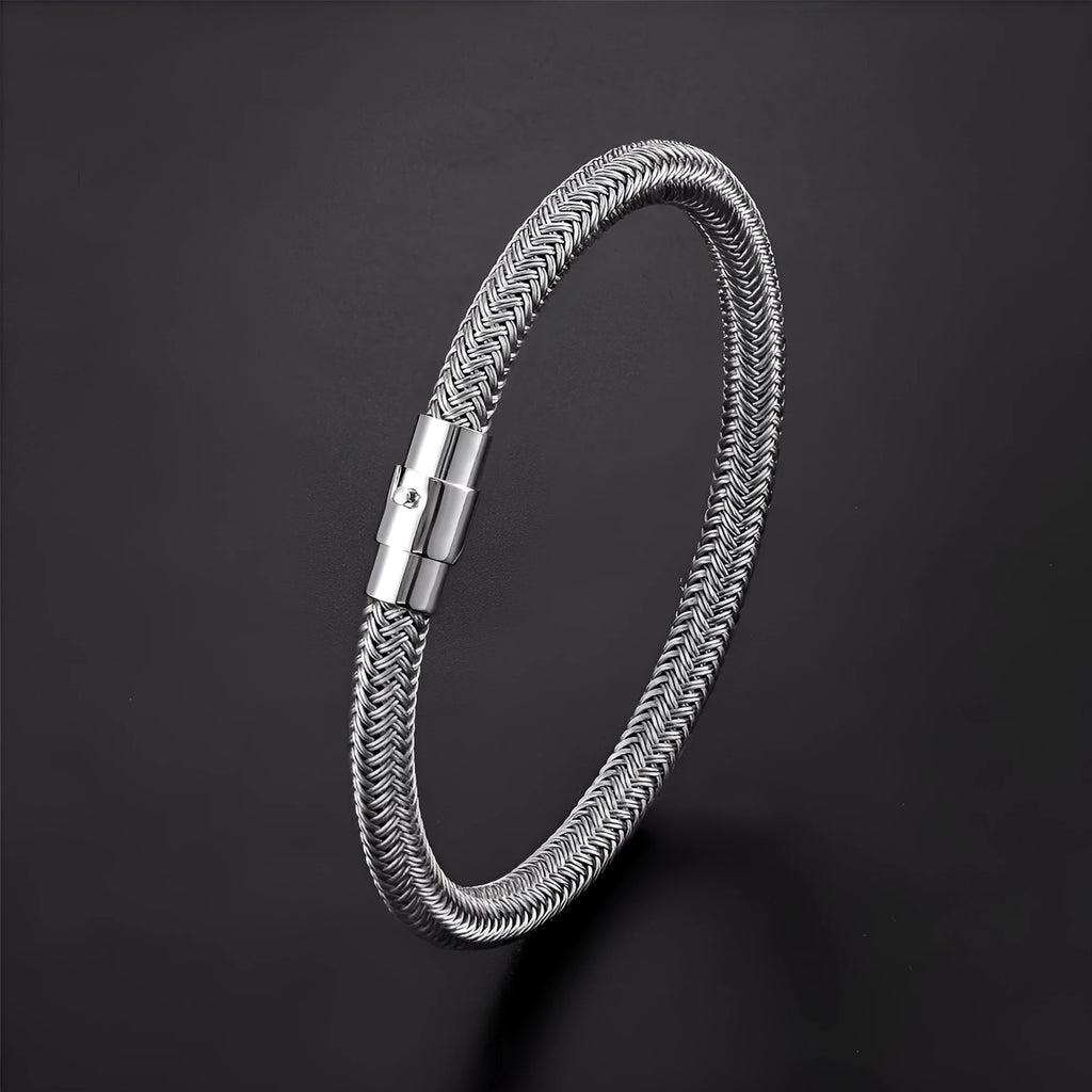 Geometric titanium steel men's bracelet with a magnet socket for charms, shown in a silver finish.