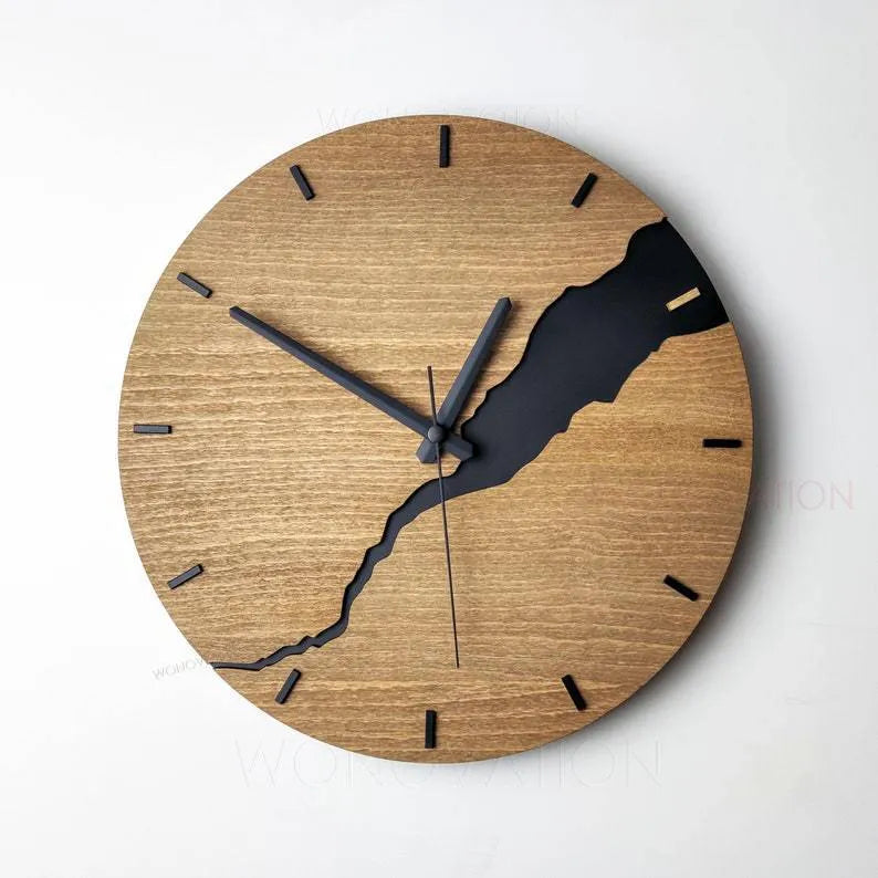 Modern wooden wall clock with a creative crack design on its face, shown in one of five available colour options.