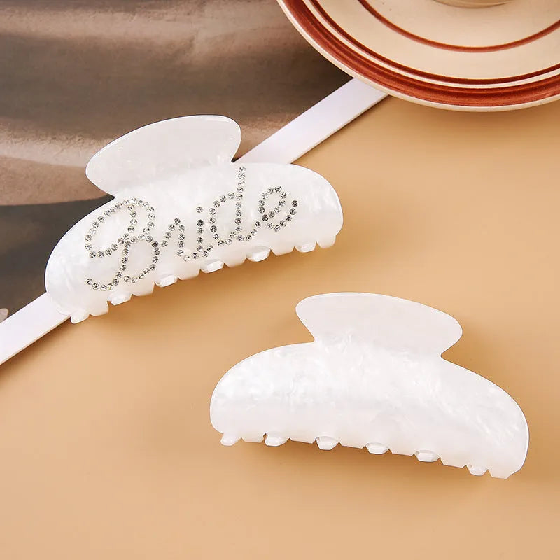 Pink and white 10cm acrylic shower hair clip with spot drill and letter decoration.