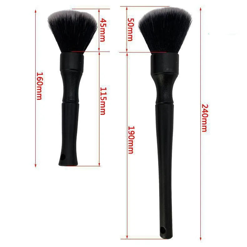 Black ultra-soft pig hair car detailing brush with PP plastic handle on a car seat.