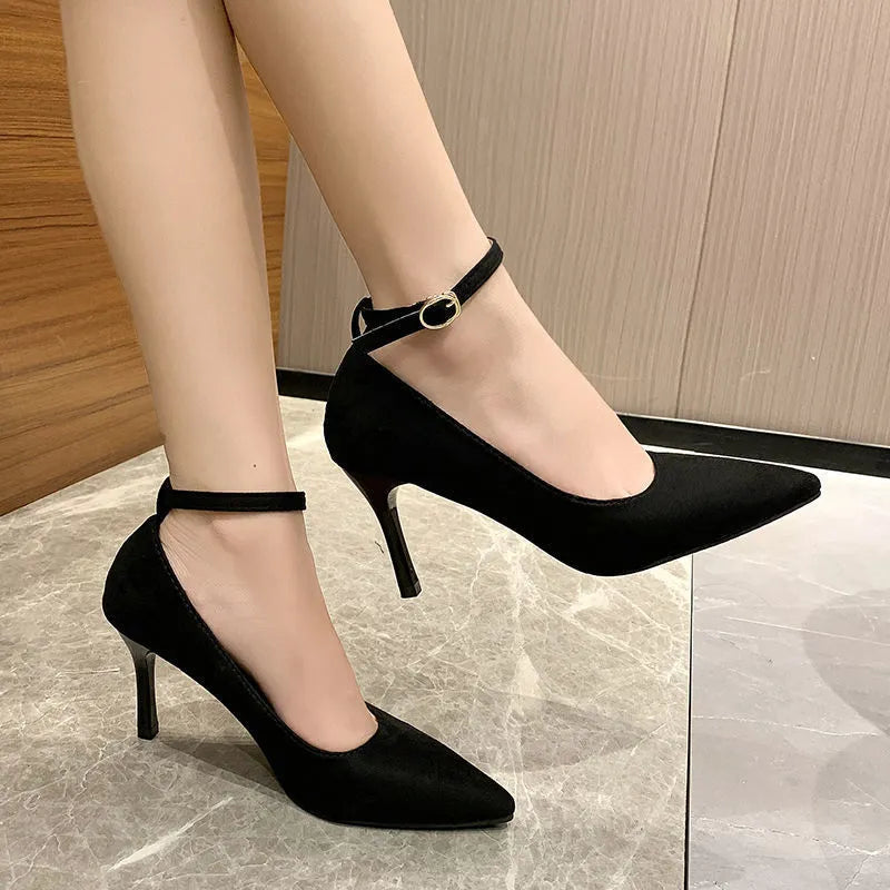 Women's black stiletto heels with buckle detail and skull pattern, showing 8cm heel