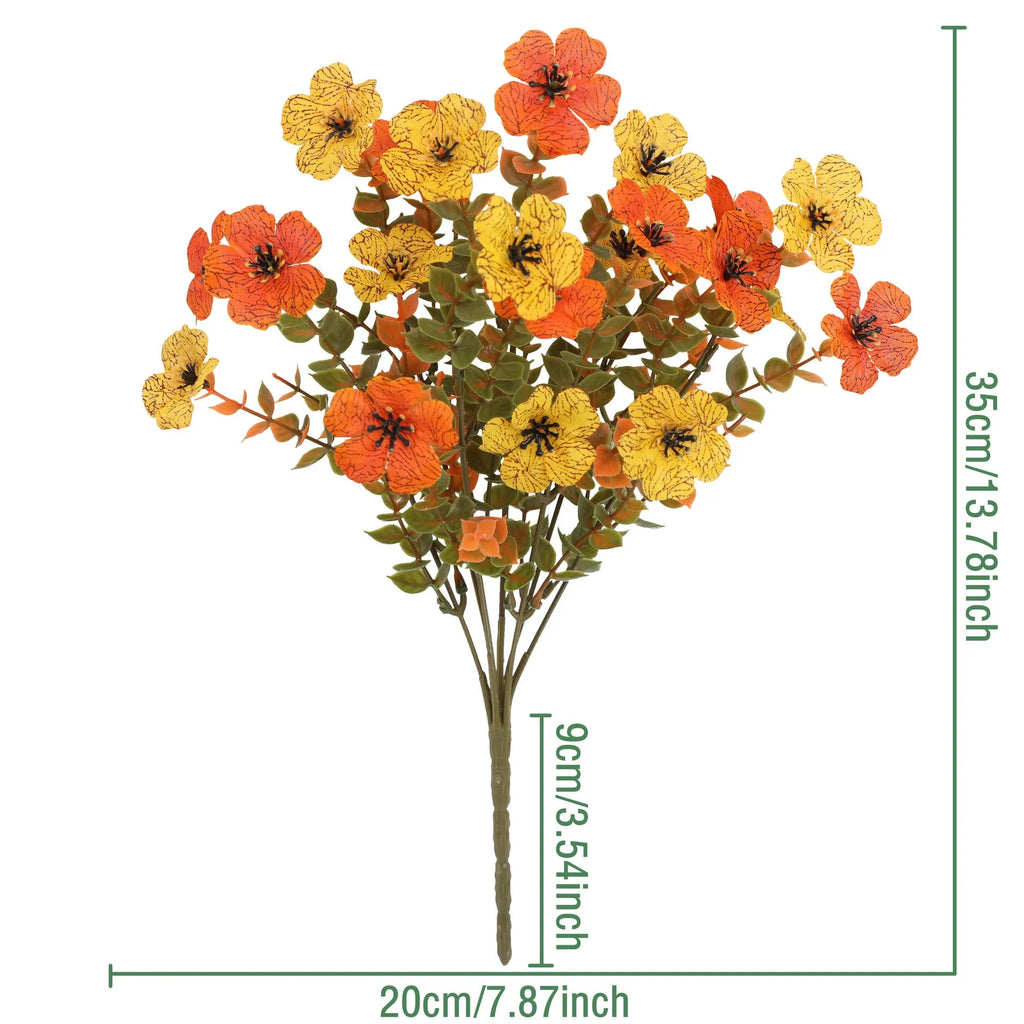 Plastic and silk artificial flower bouquet in autumn colours of red, yellow, orange and orange-yellow.