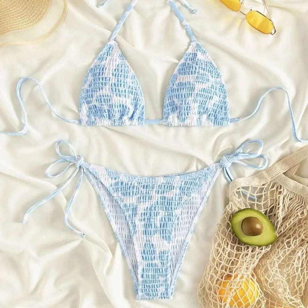 Women's floral halter neck two-piece swimsuit in briefs style, shown in light blue colour.
