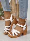 Black plus size women's Roman sandals with peep toe, chunky block heel, and ankle-strap buckle.