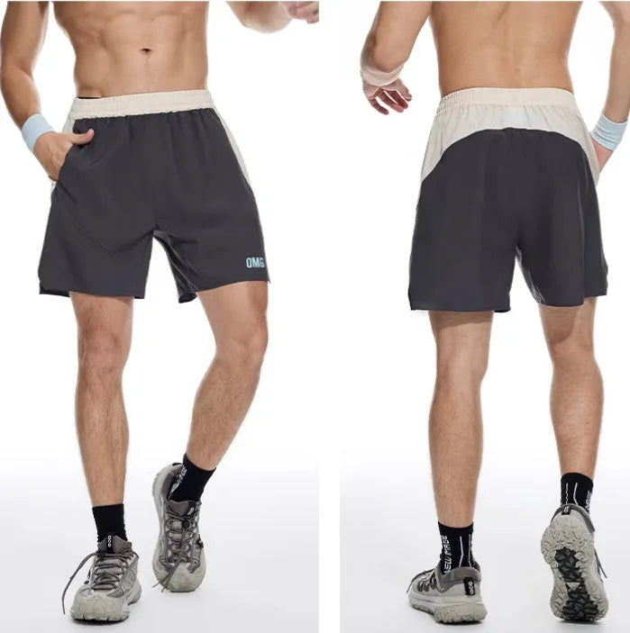 Man's loose grey workout shorts with elastic waist and lace-up fly, side view.