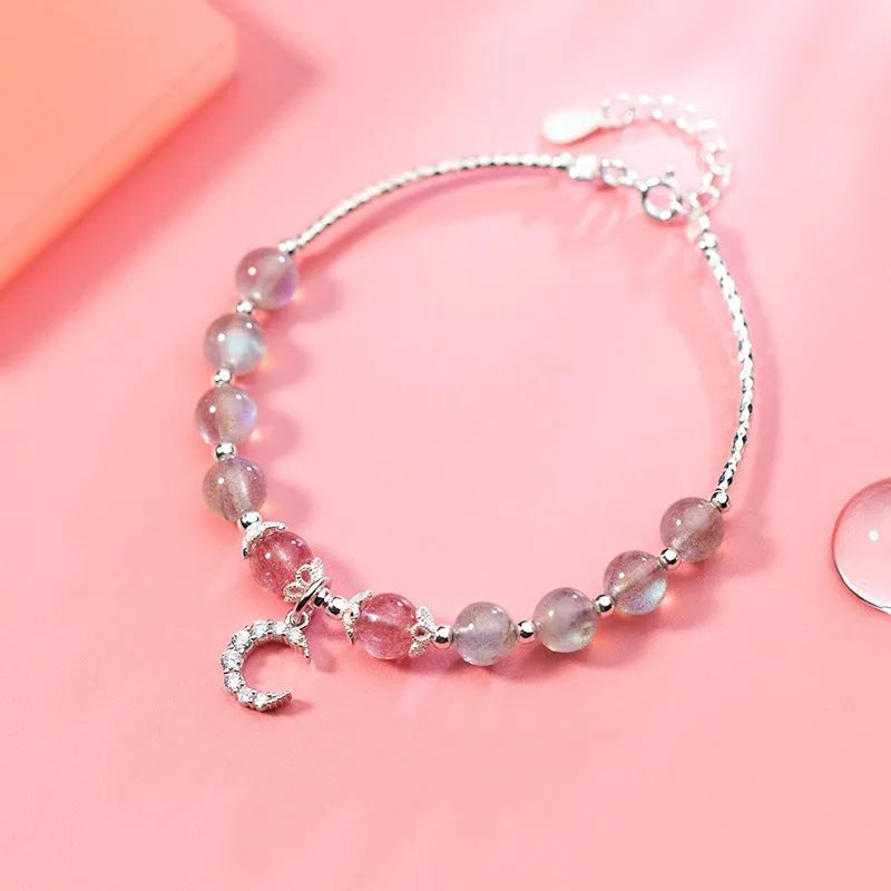 Handmade adjustable bracelet with a natural moonstone centre on a silver-toned chain.