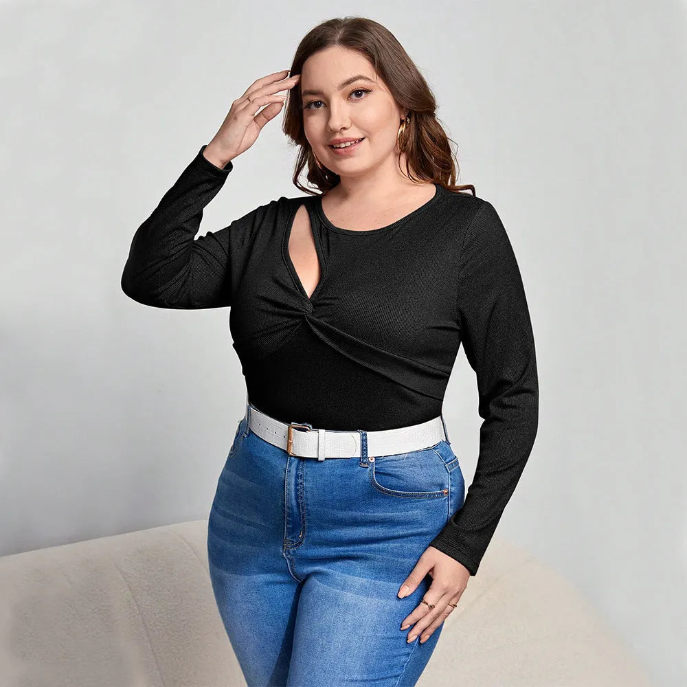 Women's slim-fit black knit pullover top with hollow-out design and long sleeves
