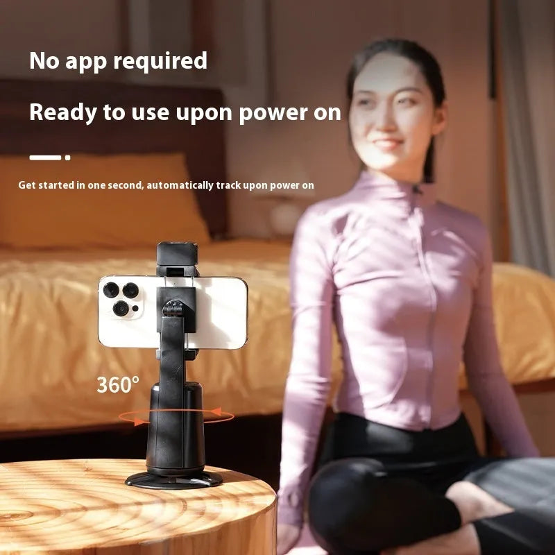 Black desktop phone holder with intelligent face tracking, rotating head and ribbon lights with remote control