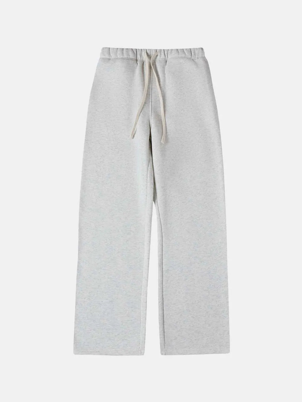 Man wearing black fleece-lined loose-fit sweatpants with a drawstring waist.