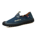 Men's brown casual shoes with mesh fabric upper and rubber sole, showing round toe and shallow-cut design.