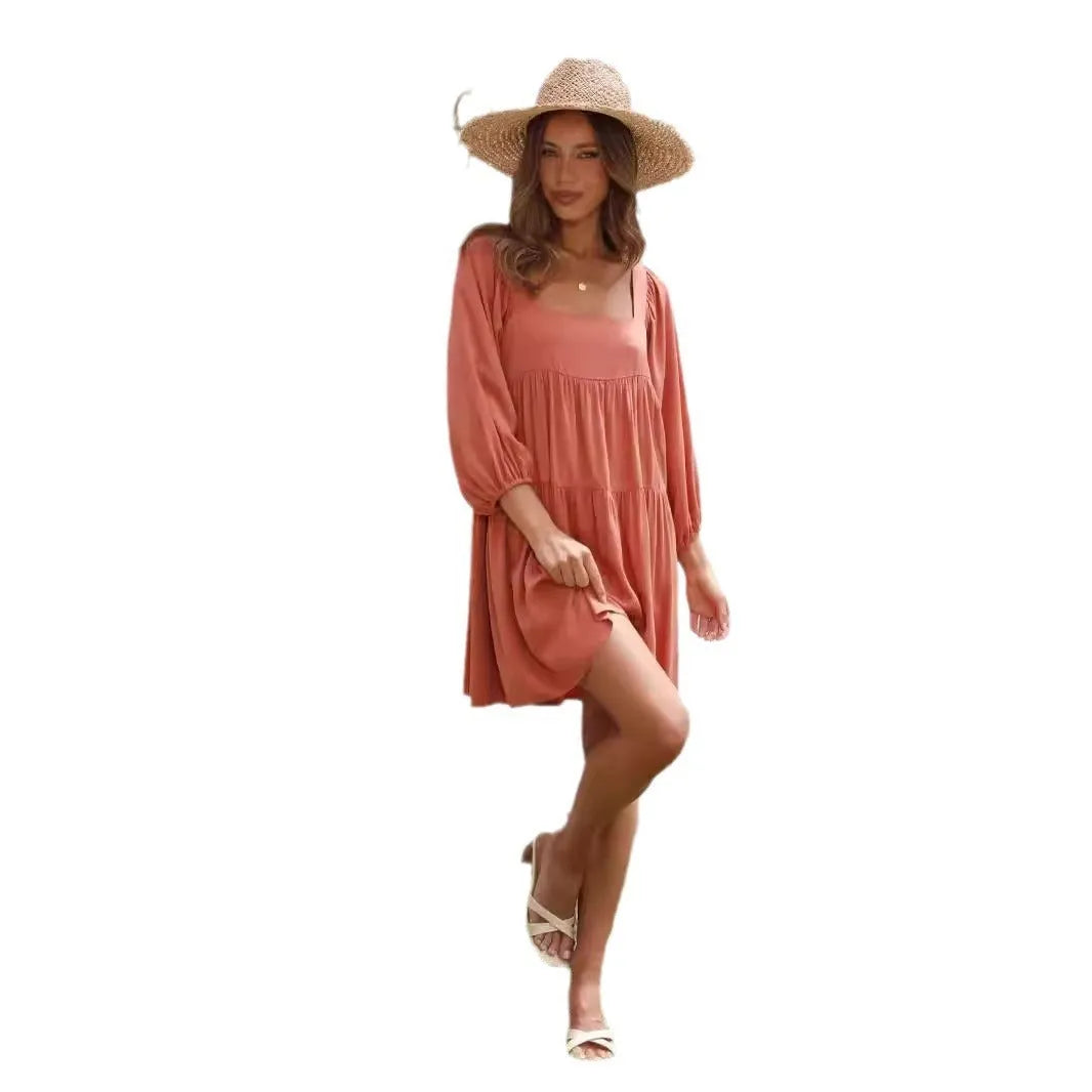 Orange backless children's dress with puff sleeves, a square collar, and a loose A-line skirt.