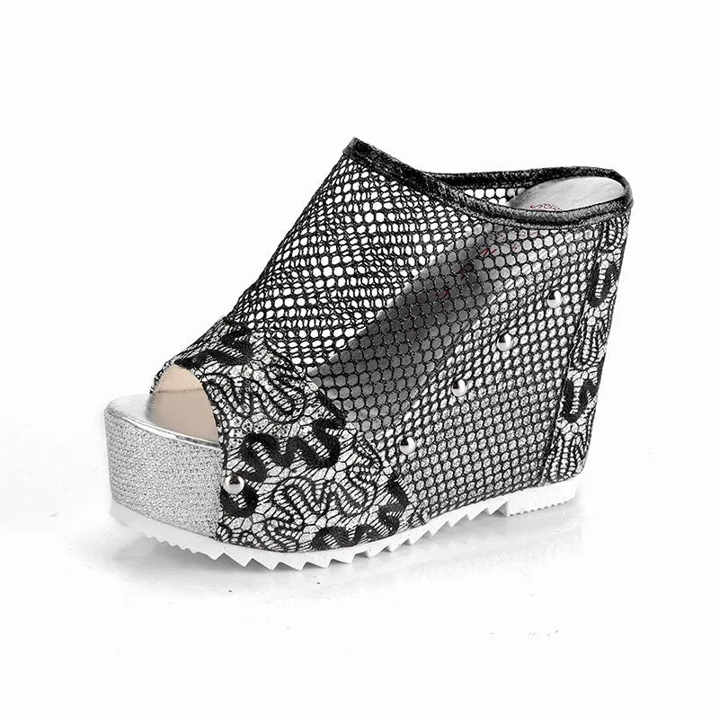 Women's black platform sandals with a hollowed-out chunky heel, mesh upper, and lace-up front.