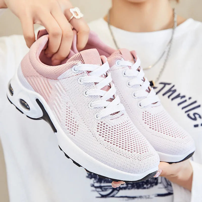 Women's Flyknit casual running shoes in pink with mesh lining and flat PVC sole