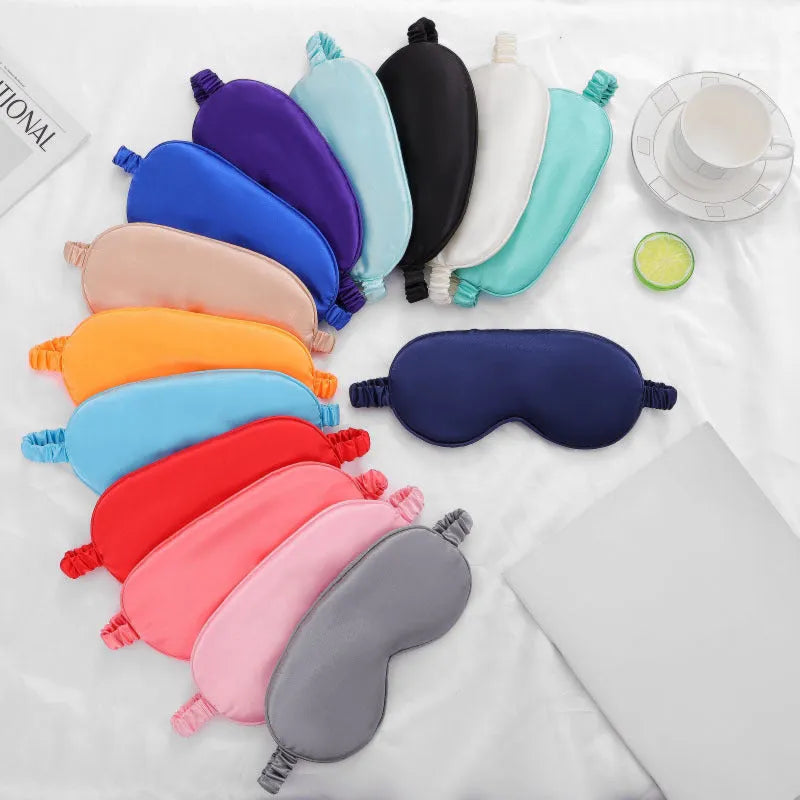 Double-sided rayon satin sleep eyeshade in multiple colour options on a white background.
