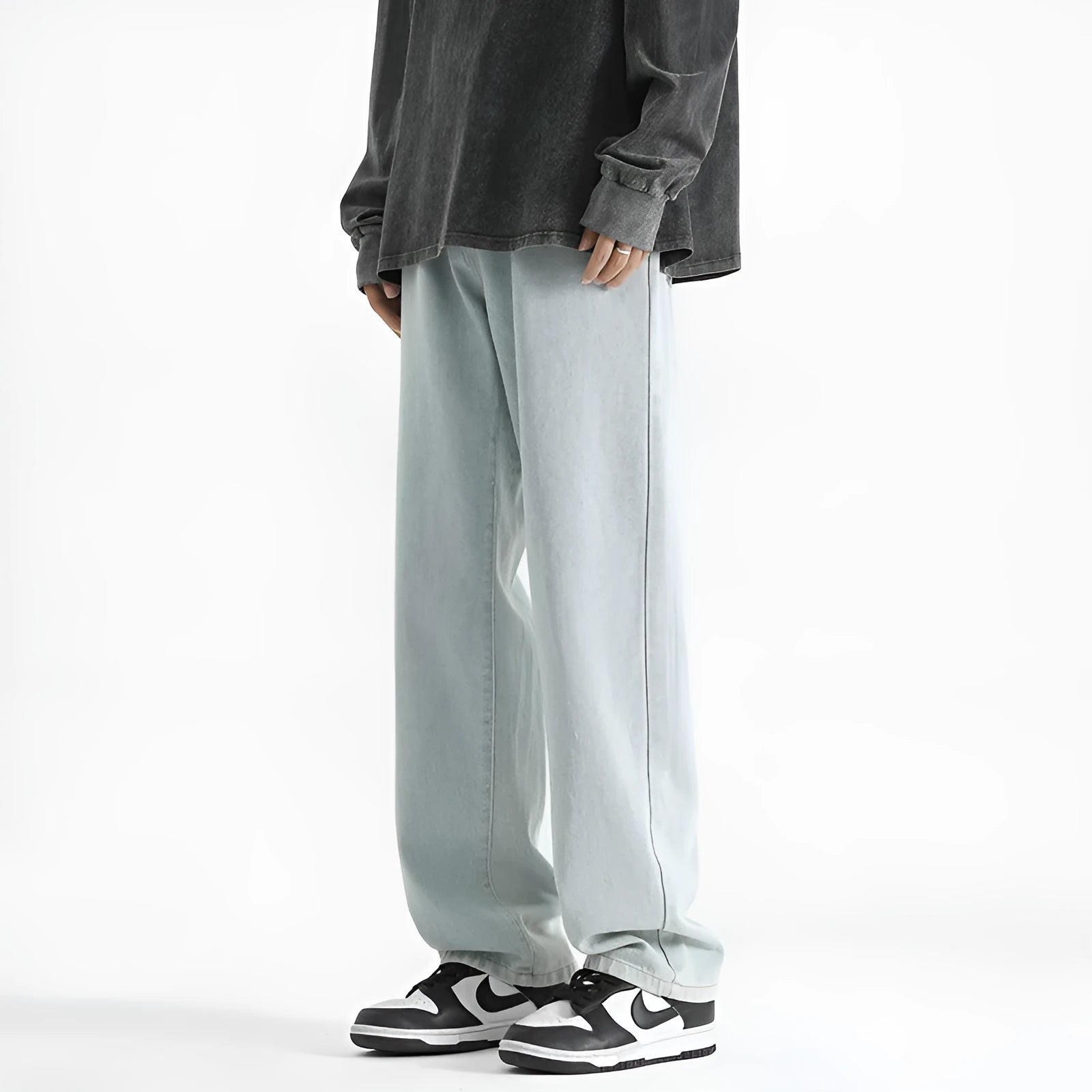 Men's light blue straight leg jeans with button waist closure on hanger