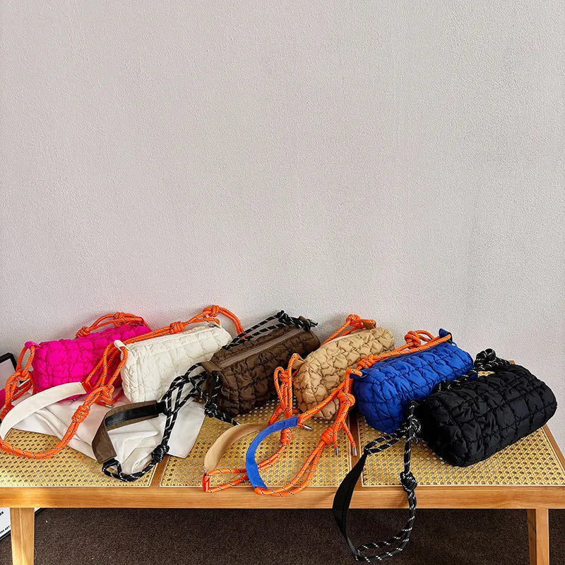 Women's lightweight nylon messenger bag in pillow shape with single shoulder strap