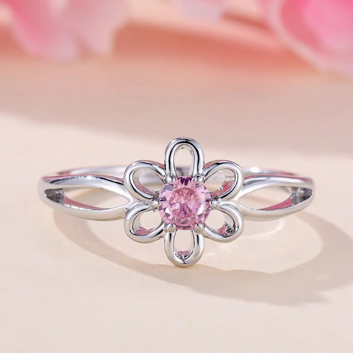 Copper flower hollow fashion ring with platinum pink diamond electroplated finish