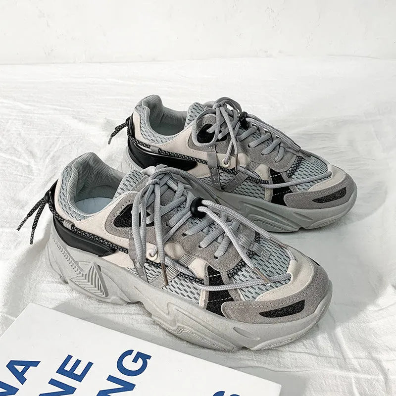 Men's white Korean style platform dad shoes with front lace-up and chunky sole on a plain background.