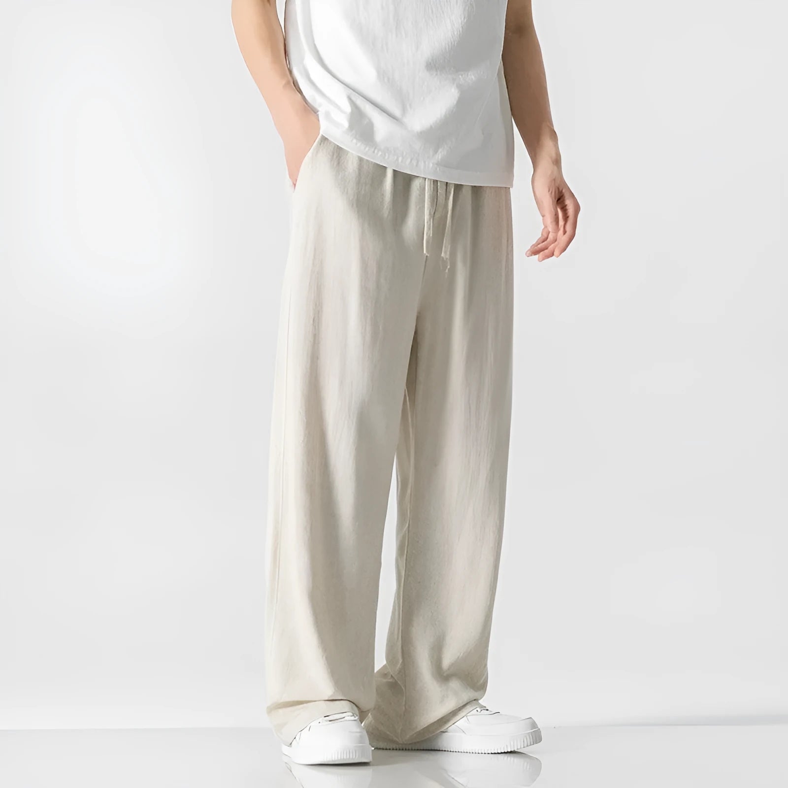 Men's light beige bamboo fibre straight-leg trousers with cropped length and drawstring waist on hanger
