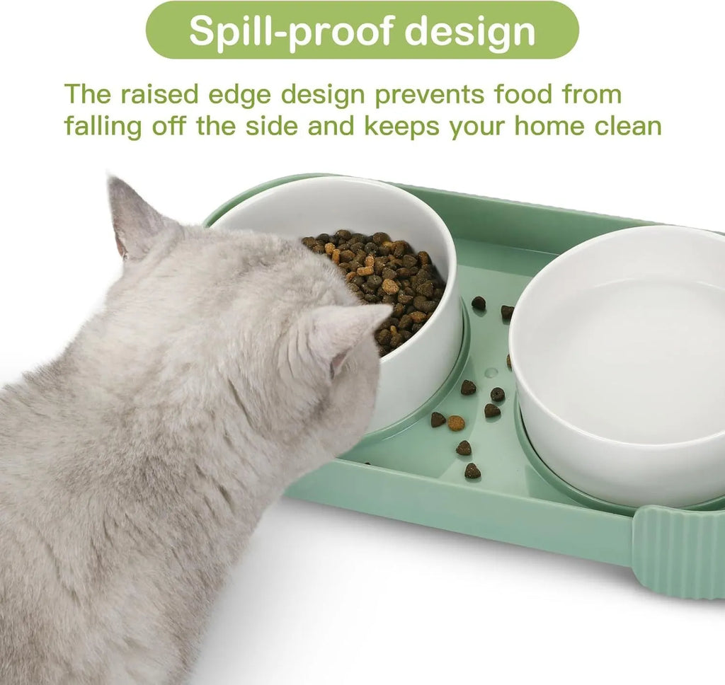 Green ceramic elevated cat bowl set with two bowls on a tilted, non-slip stand.