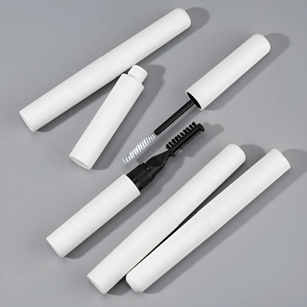 Pink and white eyebrow glue tube with applicator brush for natural wild brow styling.