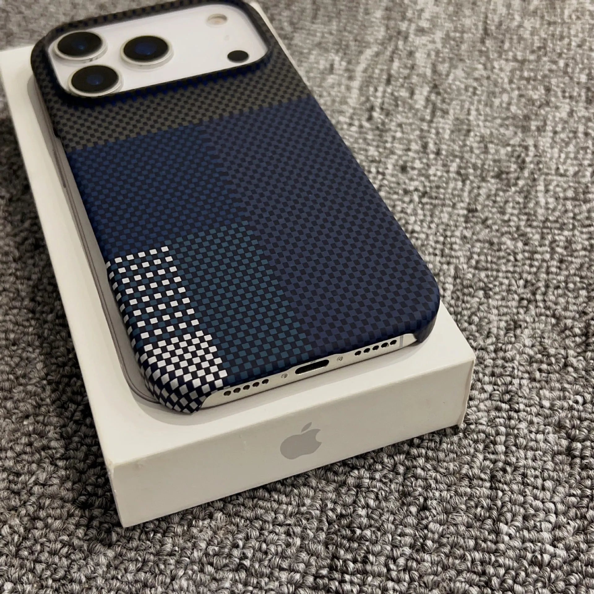 PC magnetic half-pack phone case for iPhone 17 Pro Max with plaid gradient design in Sunset Gold, on a flat surface