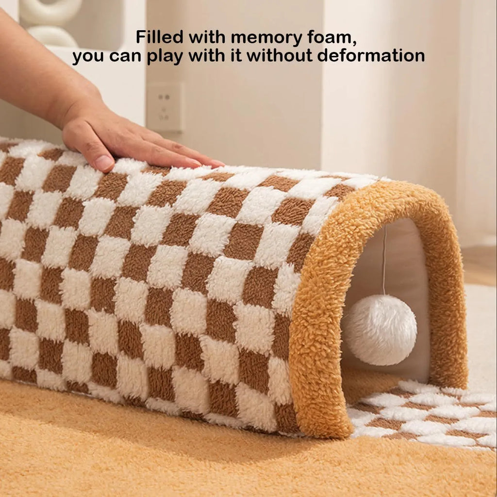 Fan-shaped plush pet bed with integrated tunnel in coffee colour, showing thick mat and anti-slip base.