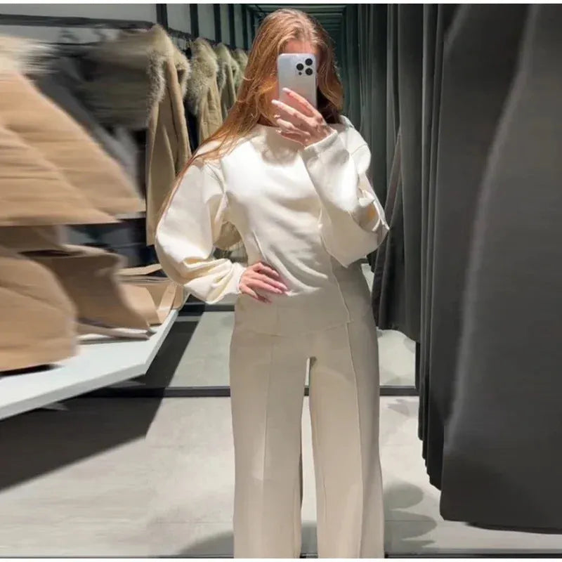 Women's polar fleece suit set with long sleeve O-neck top and wide leg trousers in multiple colour options.