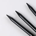 Set of six graphite pencils and three carbonized pencils packaged on a white suction card.