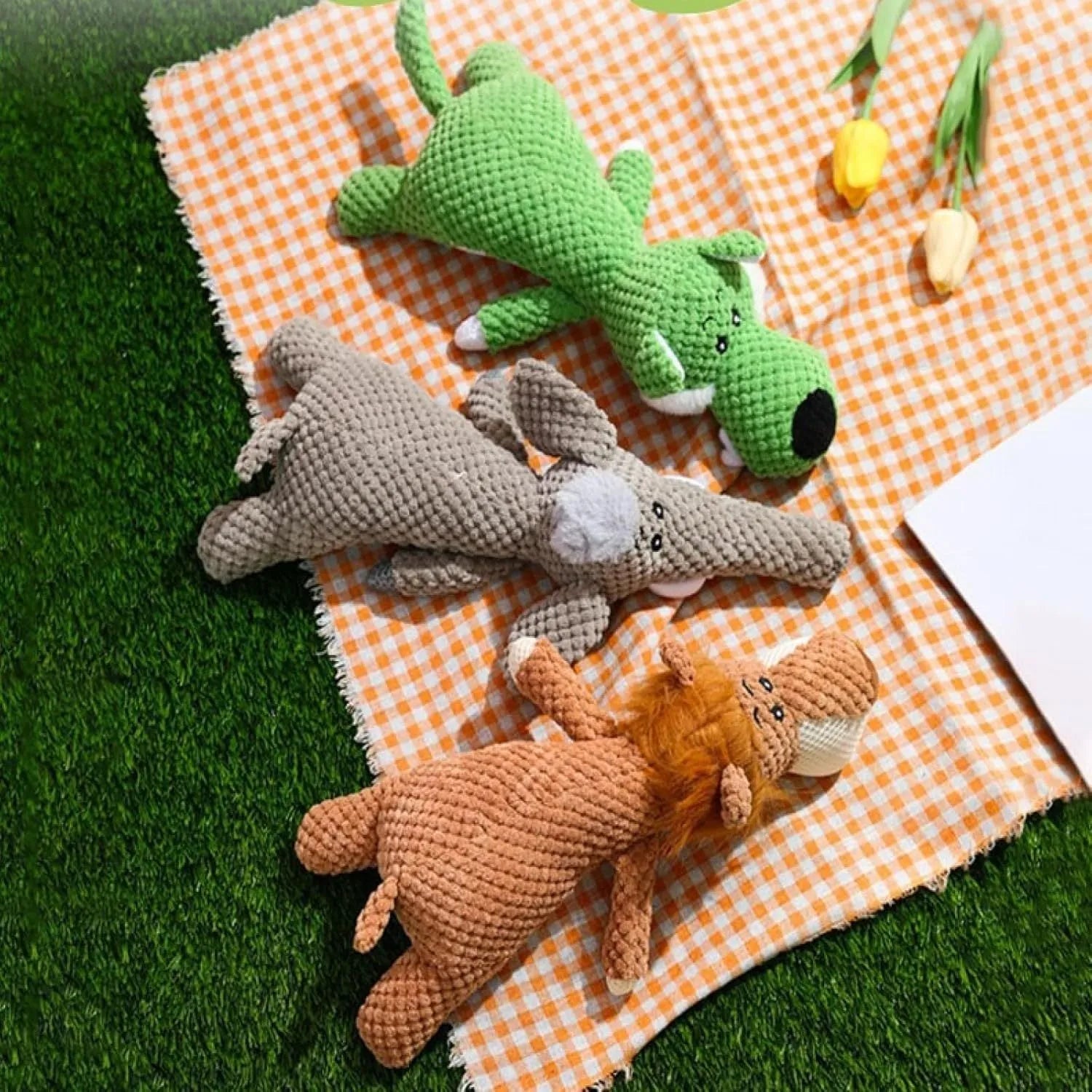Plush dog toy with corn-kernel texture and animal shapes in green, grey or yellow
